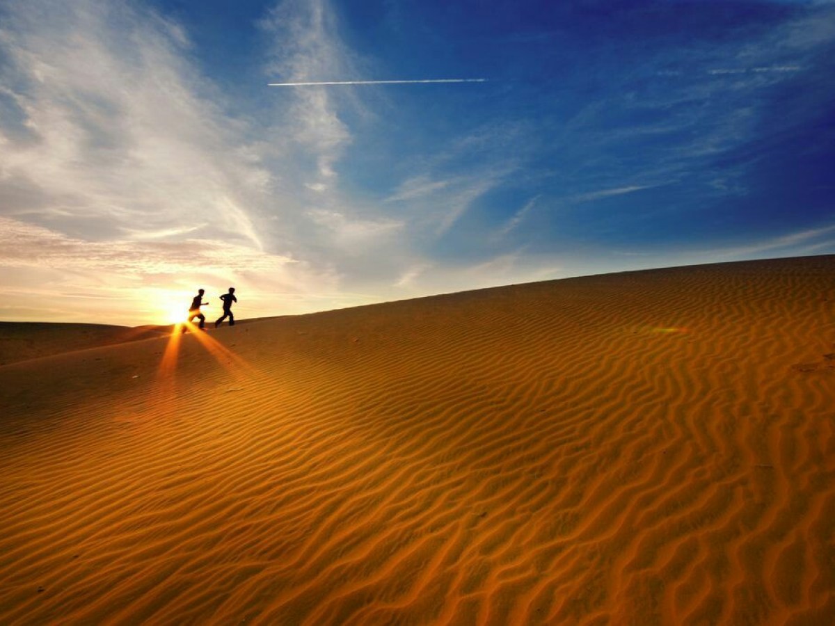 a sunset over a beach