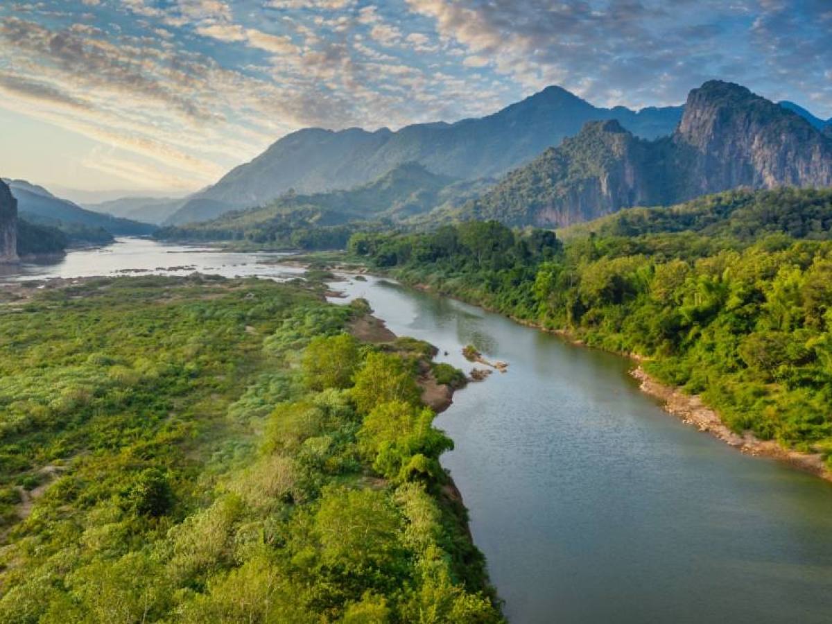 a body of water with a mountain in the background