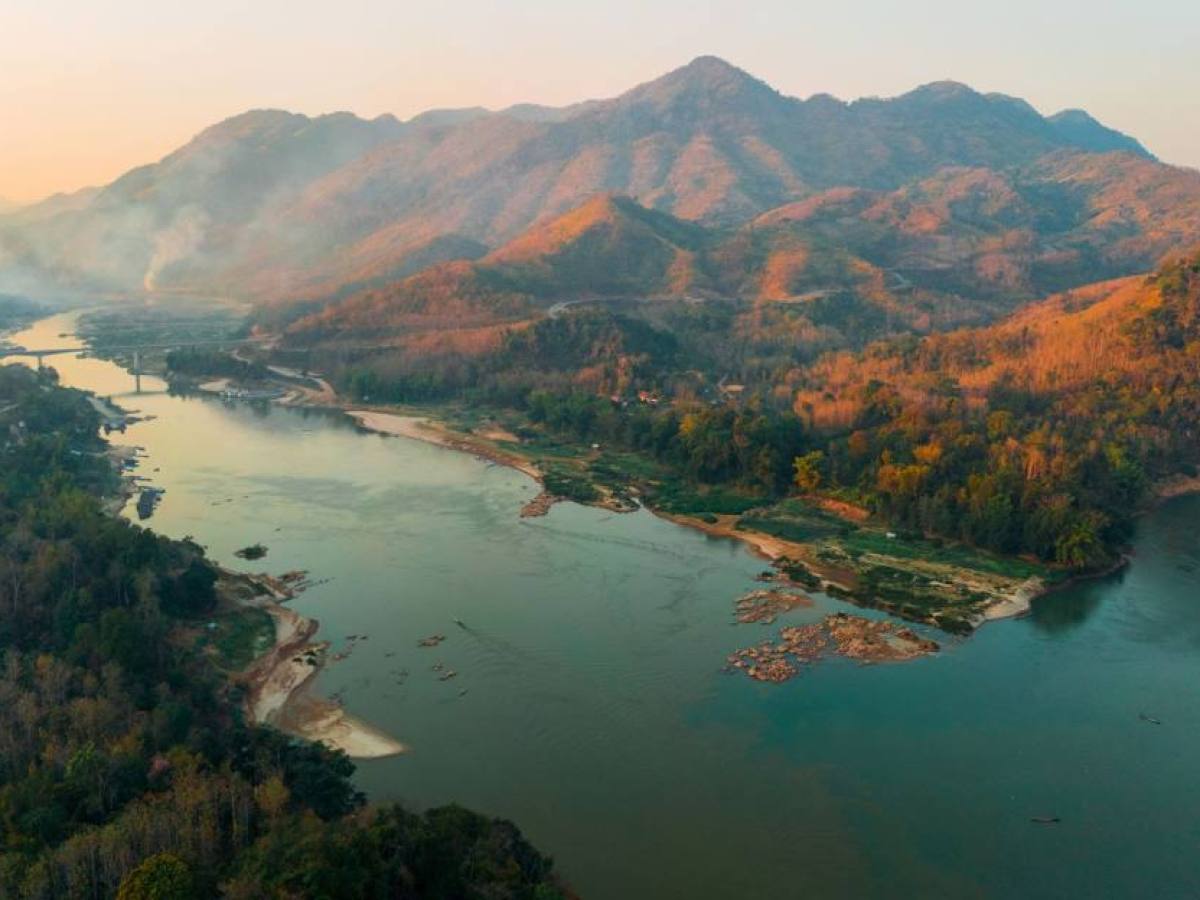 a view of a large body of water with a mountain in the background