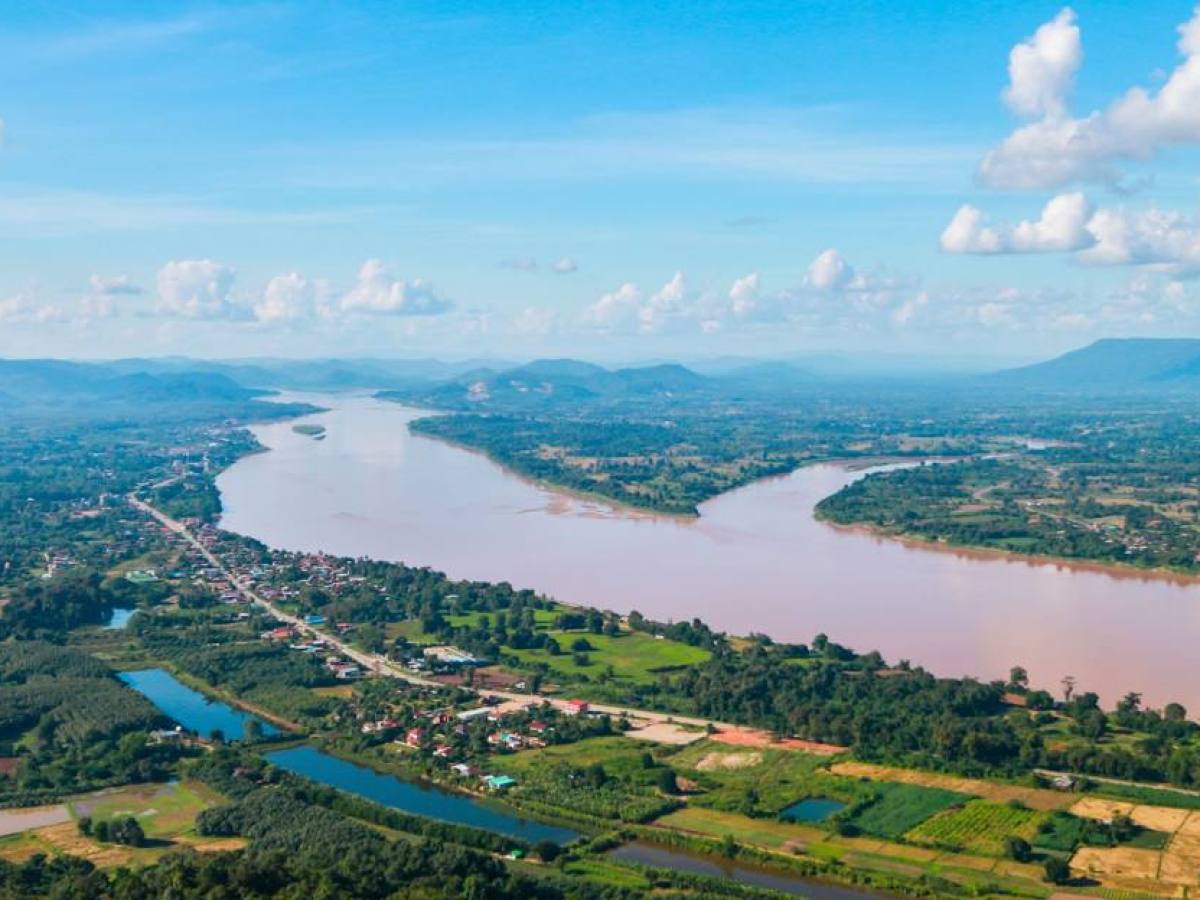 a view of a large body of water with a mountain in the background
