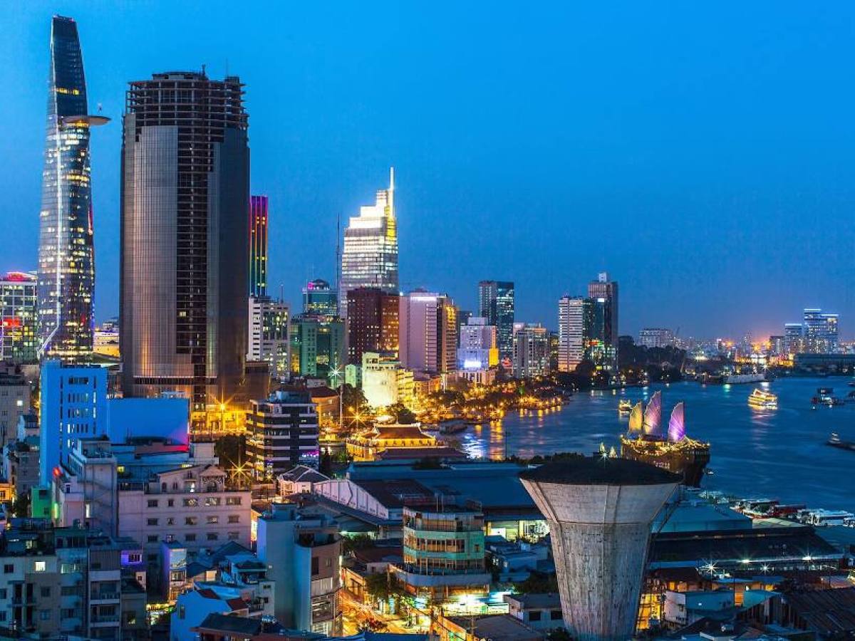 a body of water with a city in the background
