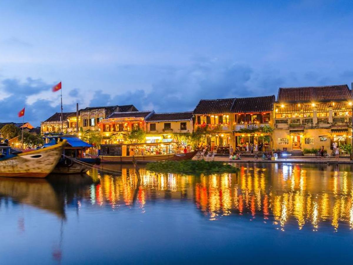 a small boat in a harbor next to a body of water