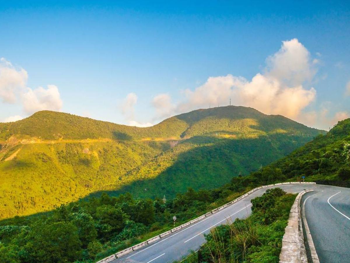 a highway with a mountain in the background