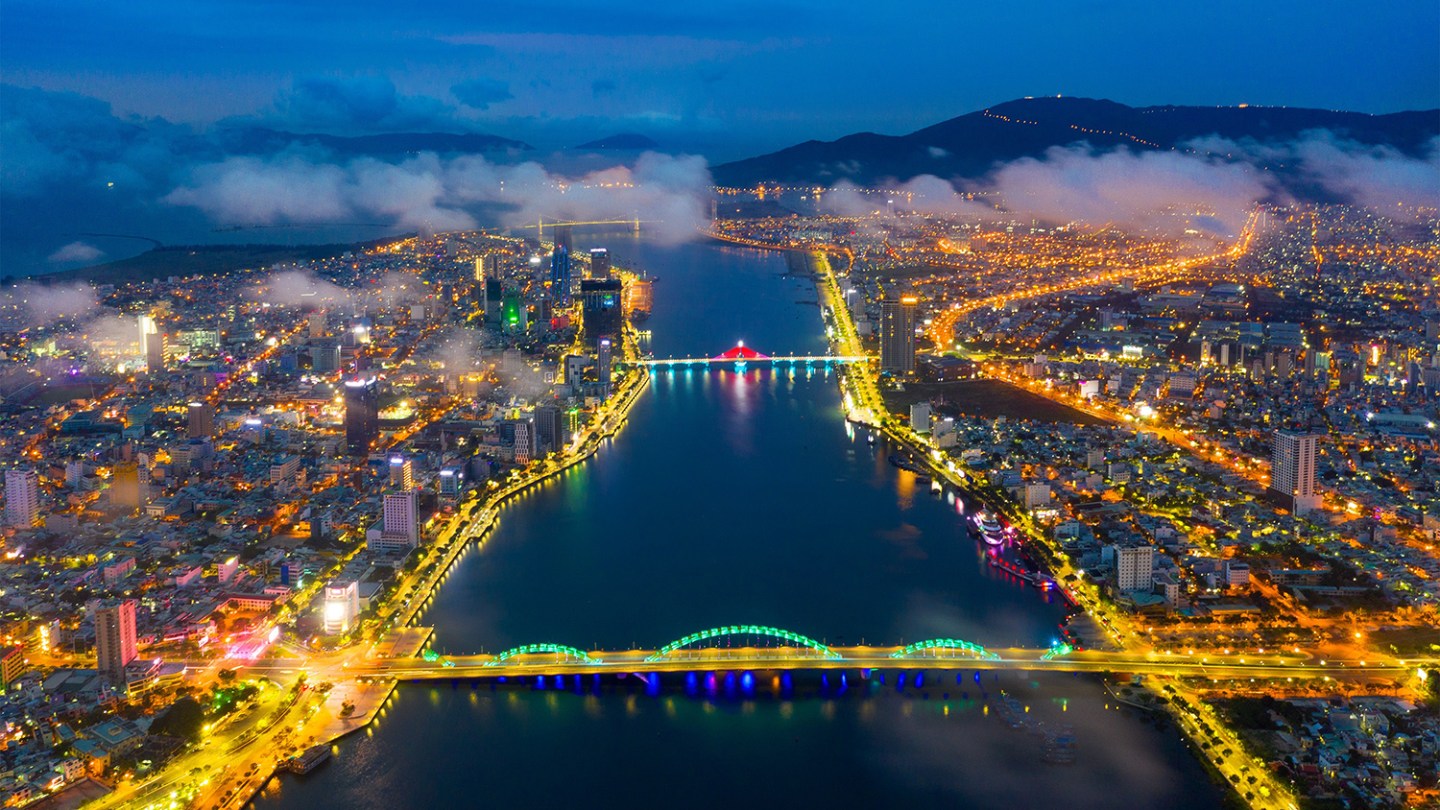 a view of a large body of water with a city in the background