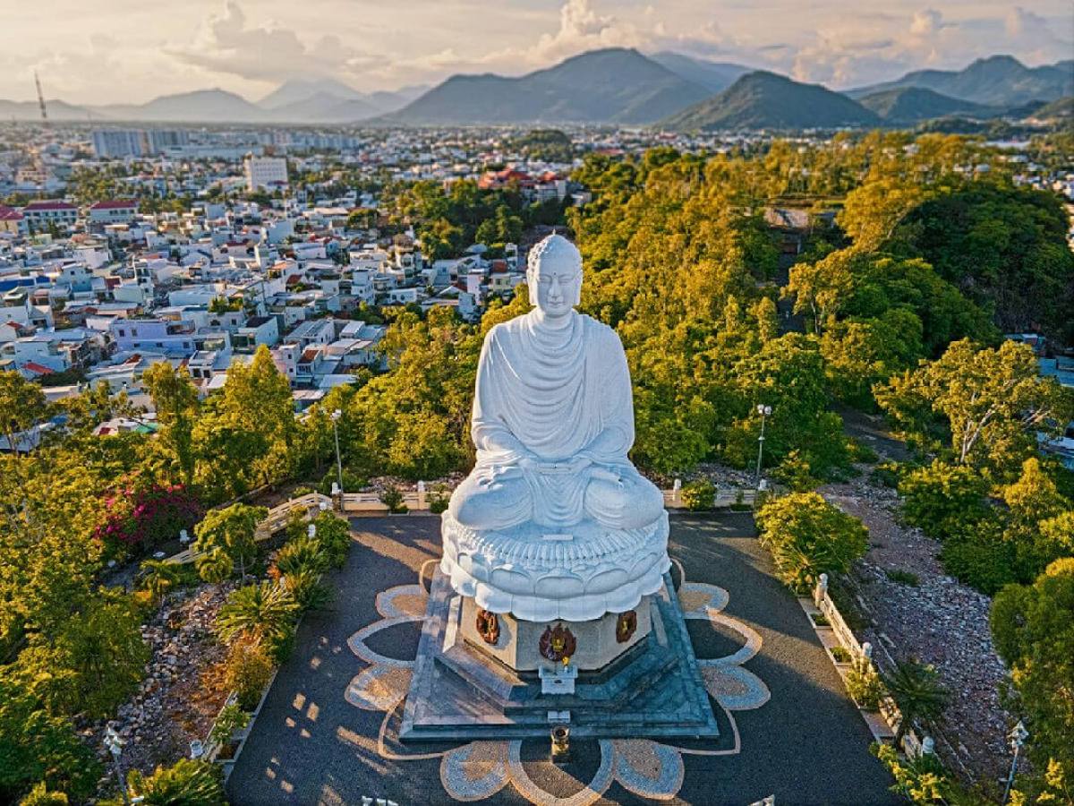 a person standing in front of a mountain