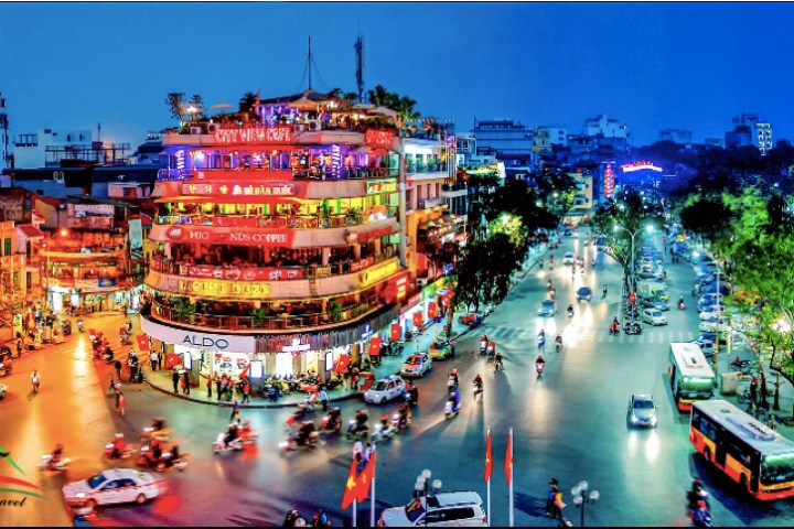 a view of a city street filled with traffic at night