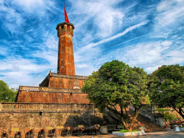 a large brick building with a clock tower