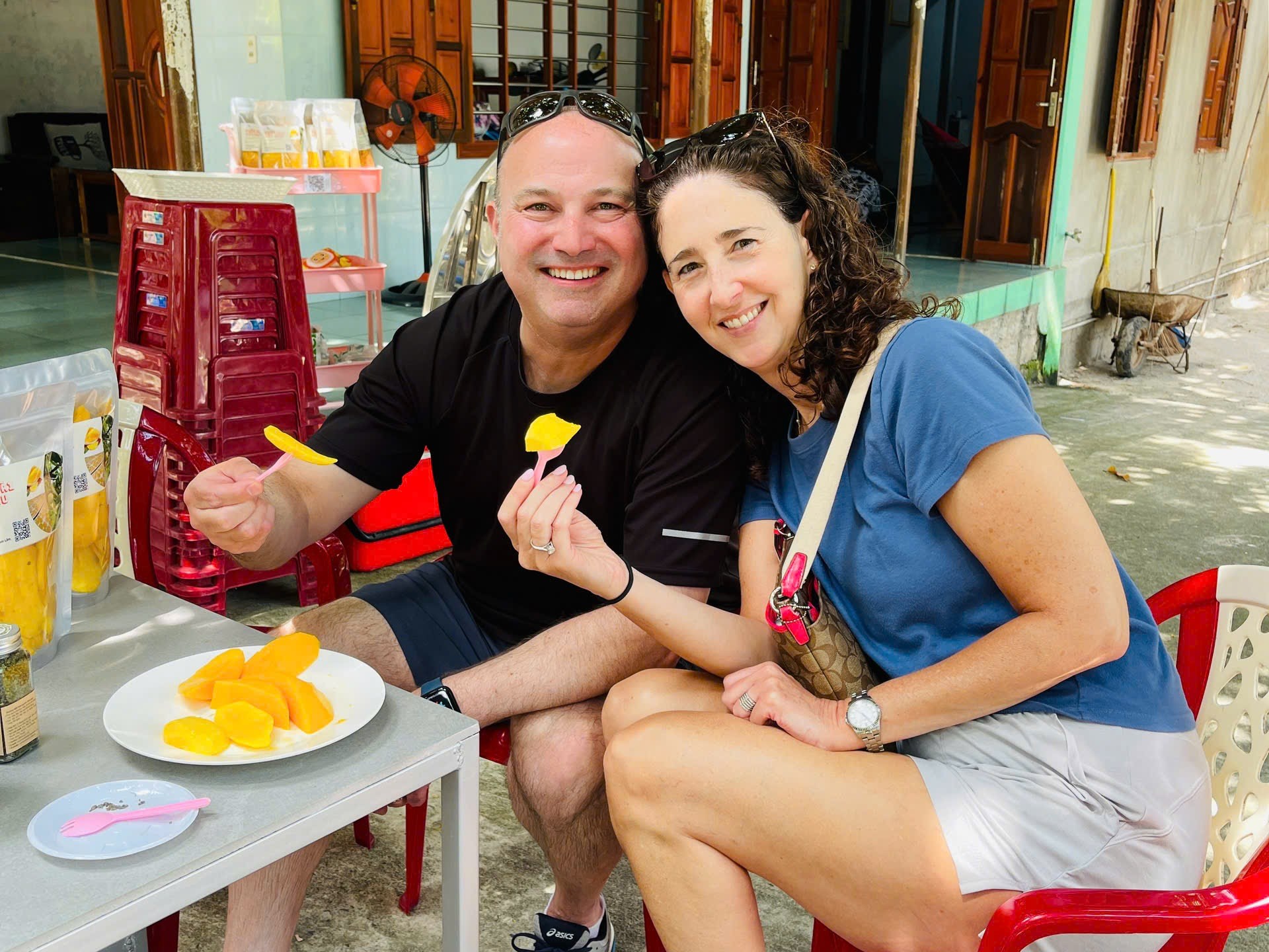 a man and a woman sitting on a table