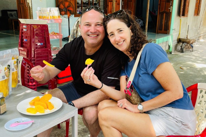 a man and a woman sitting on a table