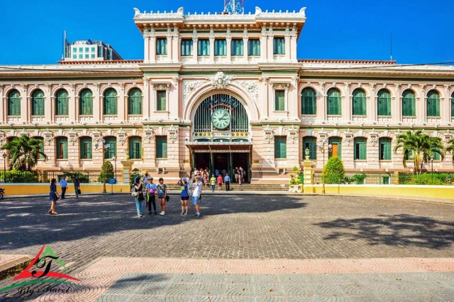 people walking in front of a building