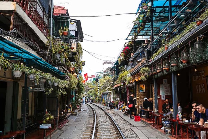 a large long train on a busy street