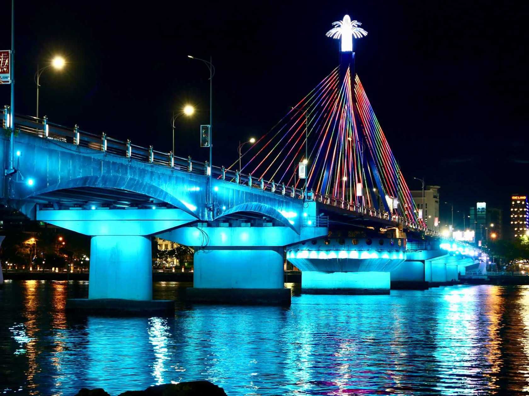 a large bridge lit up at night