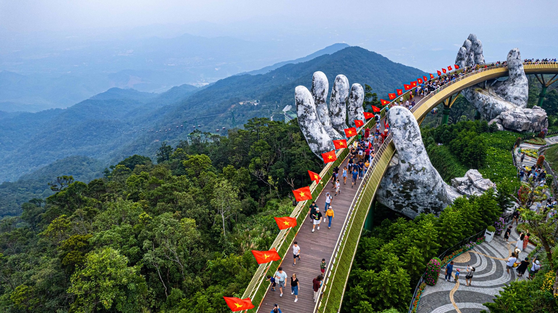 a train traveling down train tracks near a mountain
