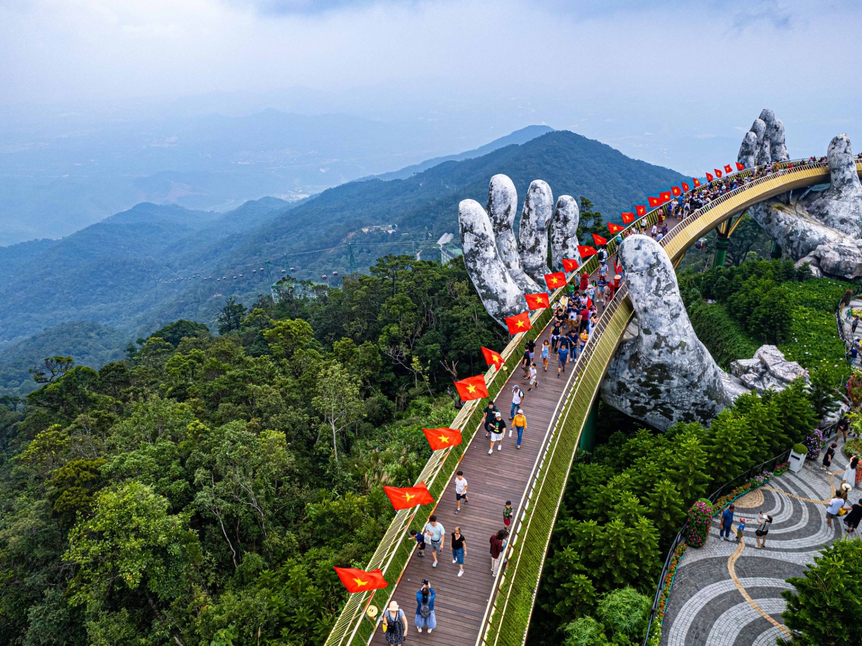 a train traveling down train tracks near a mountain