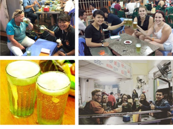 Groups of people enjoying drinks at tables, with two glasses of beer prominently displayed.