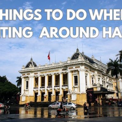 Text reads 'Things to do when visiting around Hanoi' over a historic building with palm trees.