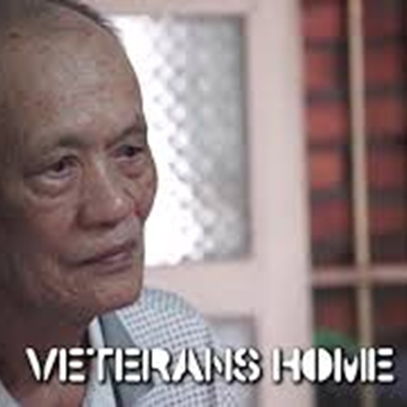 Elderly man with gray hair in a room, text: 'Veterans Home'.